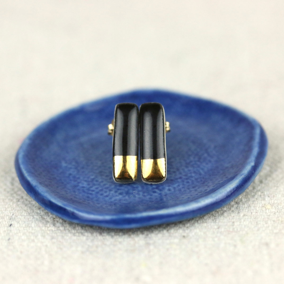 tiny reed studs on blue ceramic