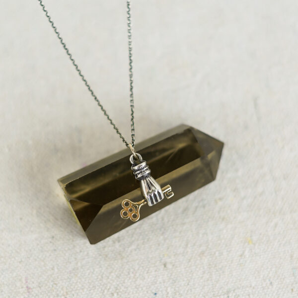gold key in hand necklace